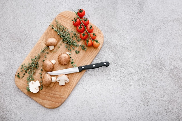 Spices and vegetables on light grey table background top view