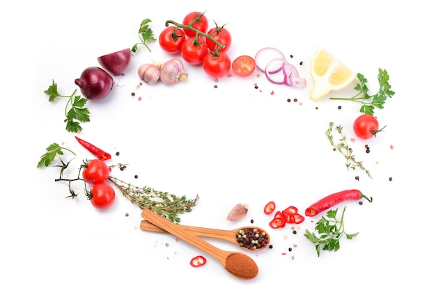 Spices and vegetables on white background