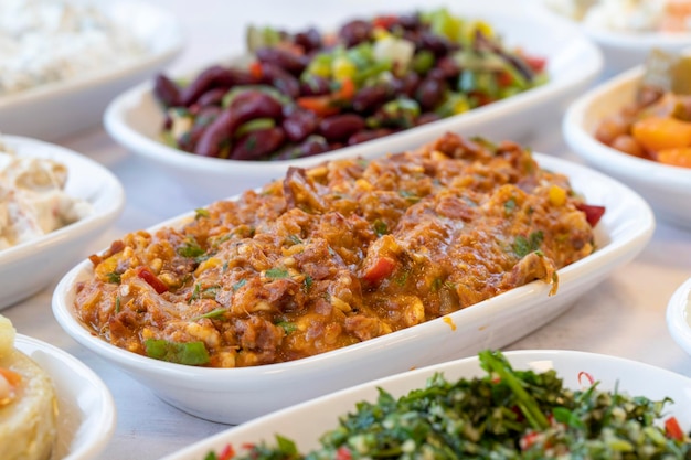 Spicy appetizer traditional turkish and arabic cuisine meze\
snack meal served alongside the main course natural vegetarian food\
bulk appetizer plates local name yandim hacer