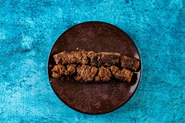 Spicy bbq chicken seekh kabab served in a dish isolated on background top view