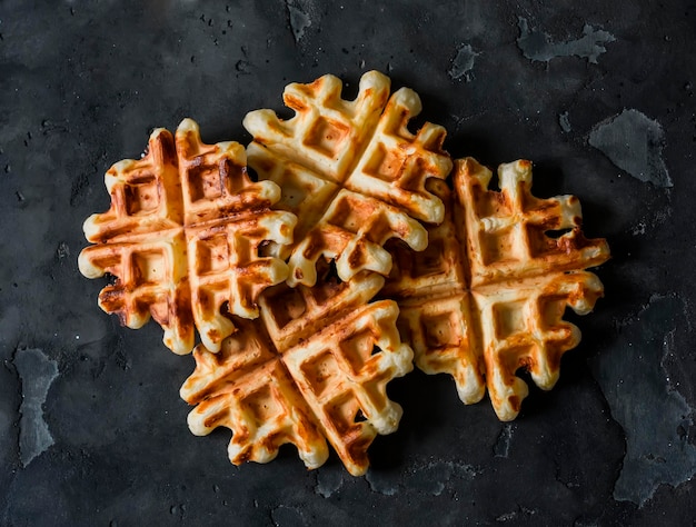 spicy cheddar cheese waffles delicious breakfast snack on a dark background top view