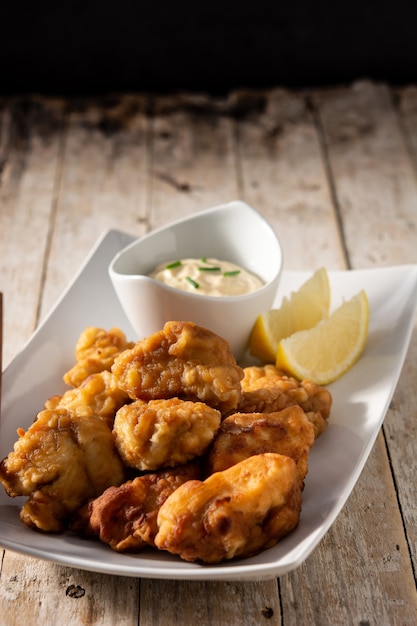 Spicy chicken karaage on wooden table