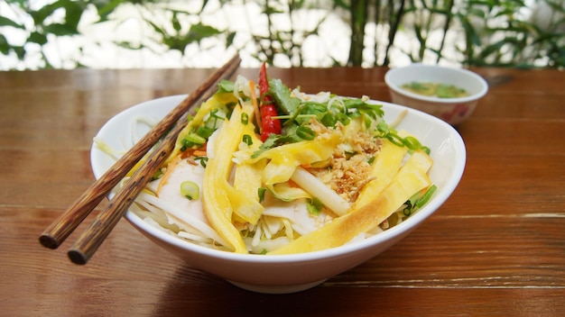 Spicy chicken meat salad with vegetables. Traditional asian recipe.