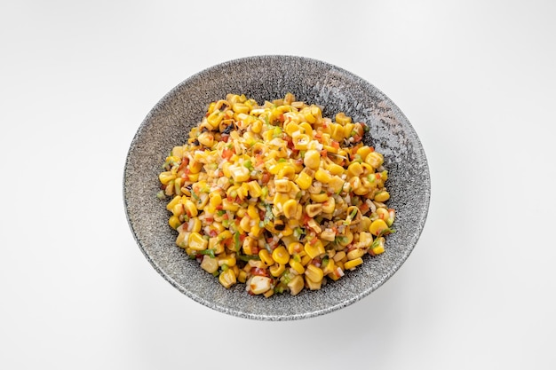 Spicy Corn Salsa with chili served in a dish isolated on grey background top view