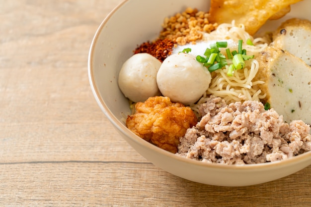 spicy egg noodles with fish balls and shrimp balls without soup - Asian food style