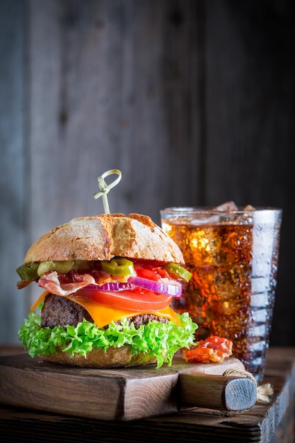 Spicy and fresh hamburger with cold drink