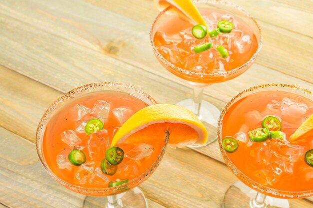 Spicy grapefruit margarita on ice in margarita glasses.