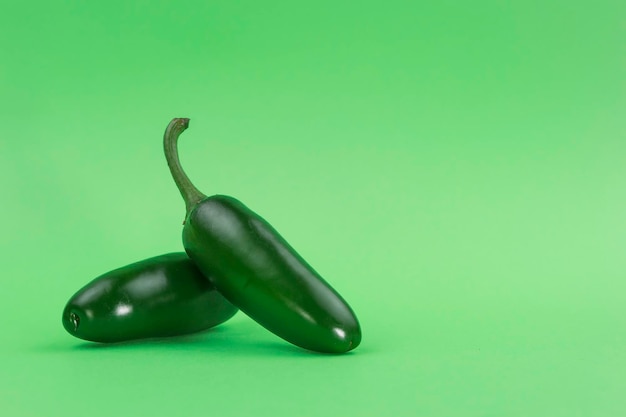 Spicy green cerranno chili vegetable on green background