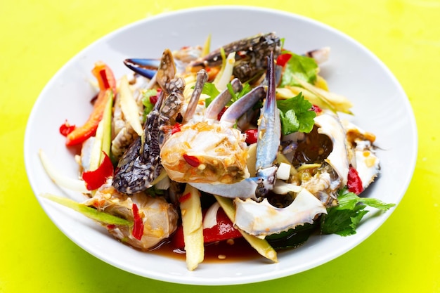 Spicy green mango salad with blue crab