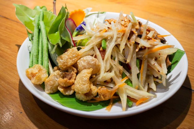 Spicy green papaya salad dish