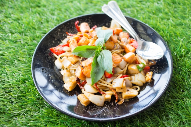 Spicy herbal spaghetti with smoked salmon meat