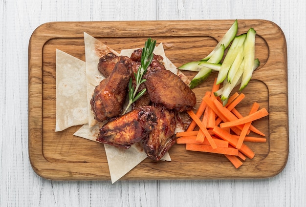 Spicy Homemade Buffalo Wings with Dip on wooden