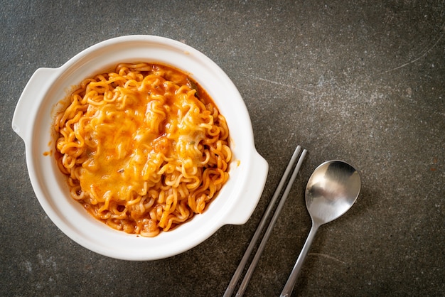 spicy instant noodle bowl with mozzarella cheese