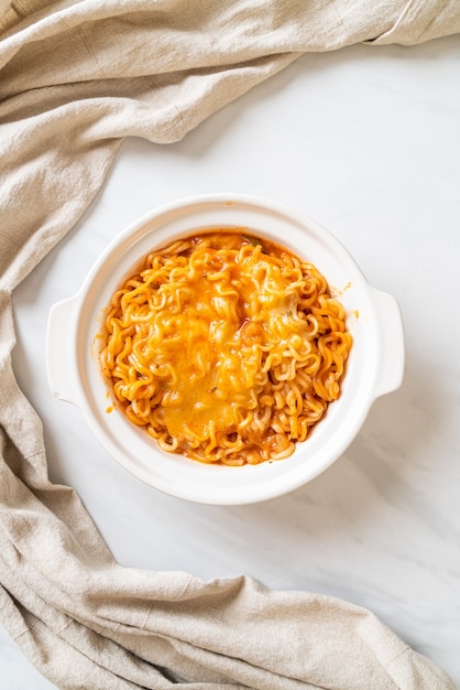 spicy instant noodle bowl with mozzarella cheese