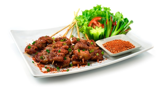 Spicy Mala Pork Intestine skewers Chinese Spice style decorate vegetable and dry dipping Spice sauce sideview