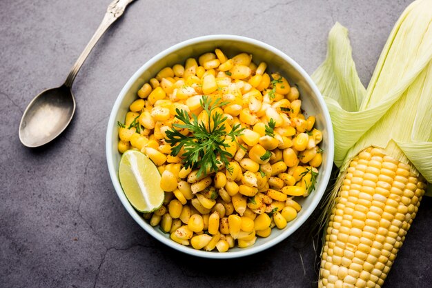 Spicy Masala Sweet Corn is a tasty roadside Indian snack, which is very easy to make. selective focus