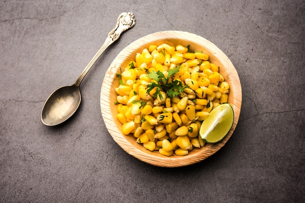 Spicy Masala Sweet Corn is a tasty roadside Indian snack, which is very easy to make. selective focus