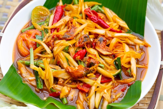 Spicy papaya salad with pickled shells