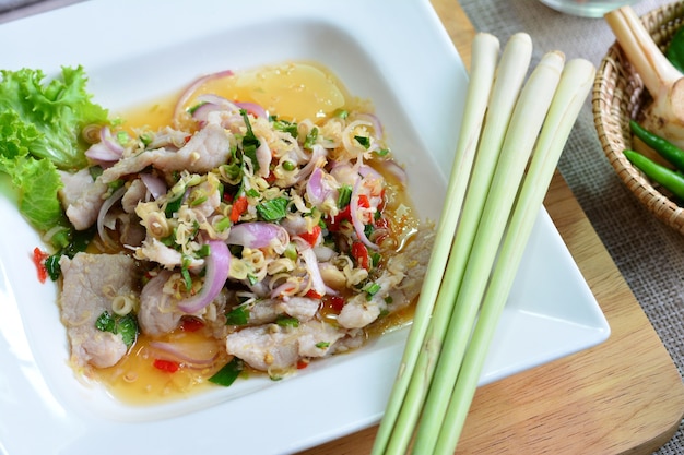 Spicy pork with lime salad