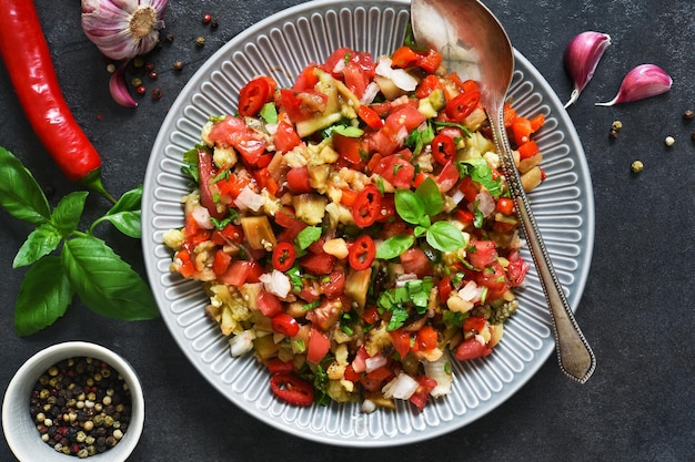 Spicy salad of baked eggplant peppers and tomatoes eggplant caviar village ratatouille