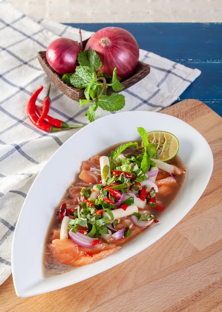 Spicy salad of fresh salmon with Thai vegetables