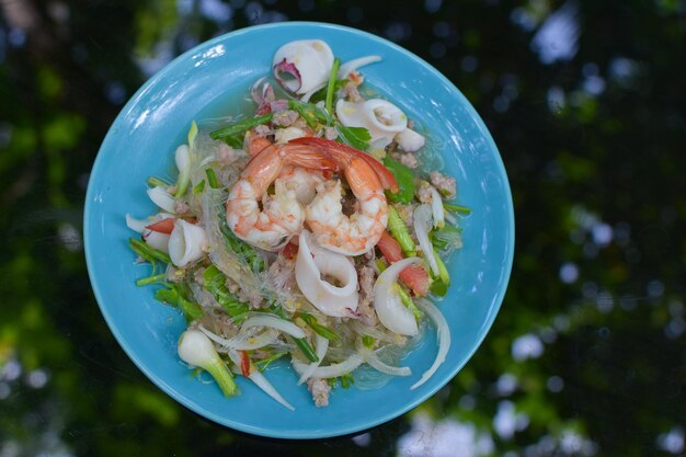 Spicy salad with seafood vermicelli and prawns
