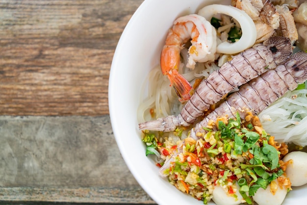 Spicy seafood noodles bowl in Thai style