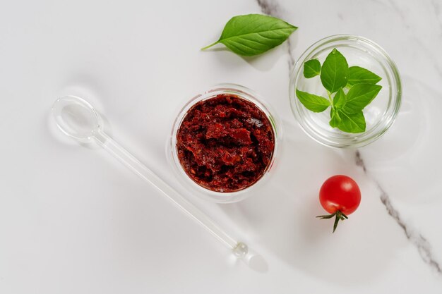 Spicy seasoning of Georgian cuisine adjika in a glass bowl