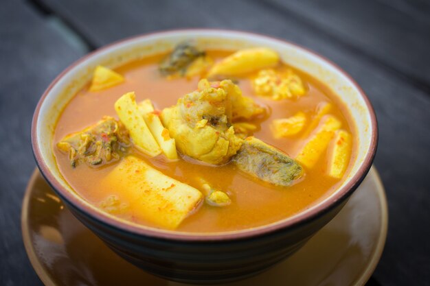 spicy sour yellow curry with  coconut shoots and sea fish is one of southern of thai food