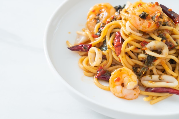 Spicy spaghetti seafood on plate