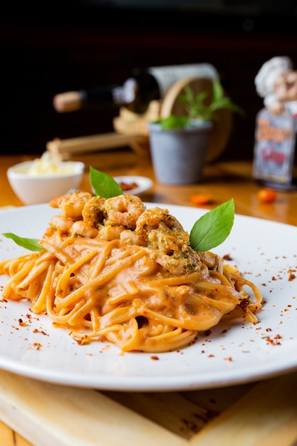 Spicy spaghetti with tomato sauce shrimp on a plate.