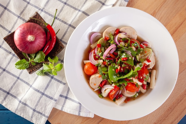 Spicy spicy salad with egg yolk and Vietnamese sausage with Thai vegetables