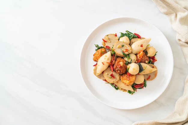 Spicy stir fried fish balls with herbs