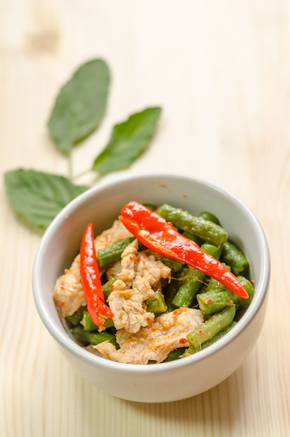 Spicy stir fried pork with red curry paste and Yard Long bean, Thai food menu