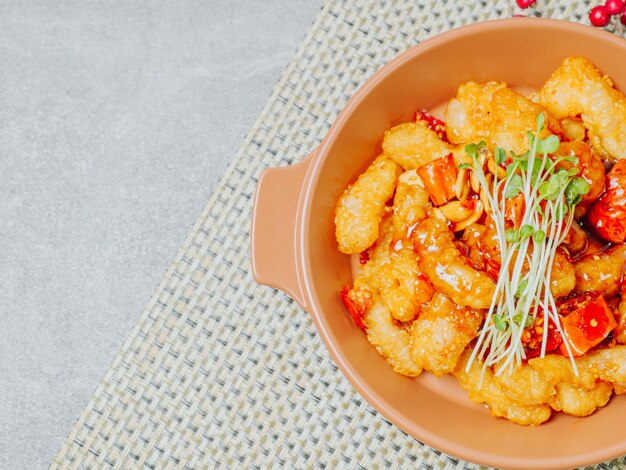 Spicy sweet and sour pork dish served on a plate