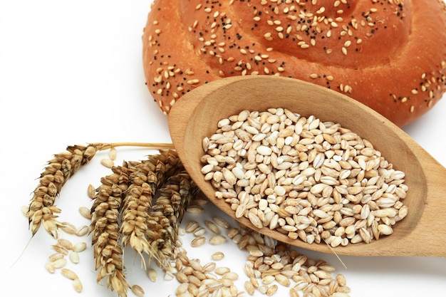 Spikelets of wheat on a wooden background