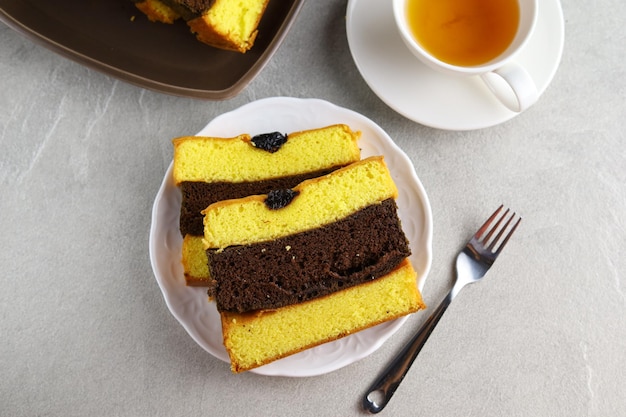 Spiku or Lapis Surabaya or Surabaya Layer Cake is three layers rich egg yolk sponge cake