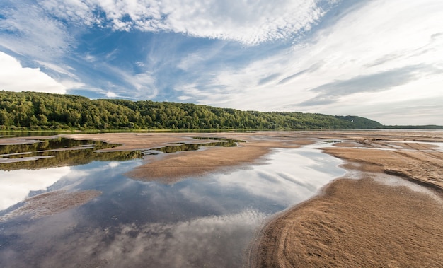 Spill on the river with beautiful sky