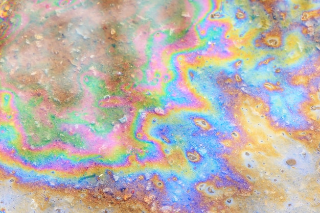 spilled gasoline rainbow background, industrial hazard spill pollution, abstract texture multicolored