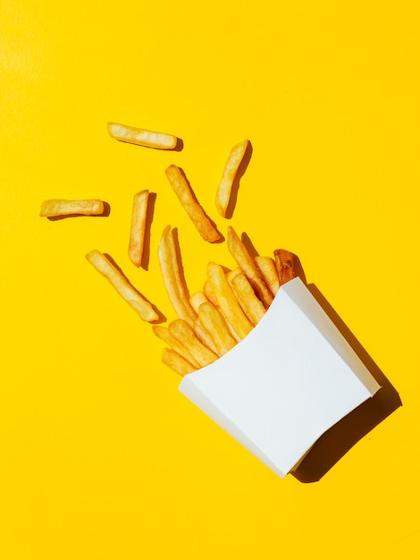 Photo spilled white box of french fries