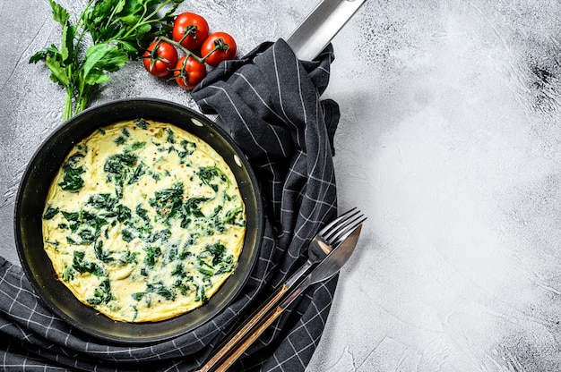 Premium Photo | Spinach cheese frittata in a pan.