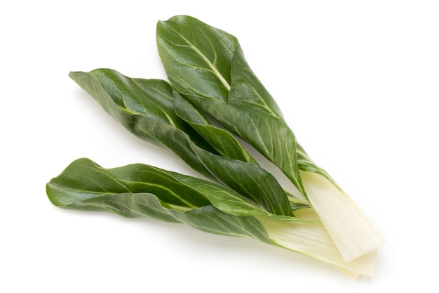 Spinach leaves close up isolated on white.