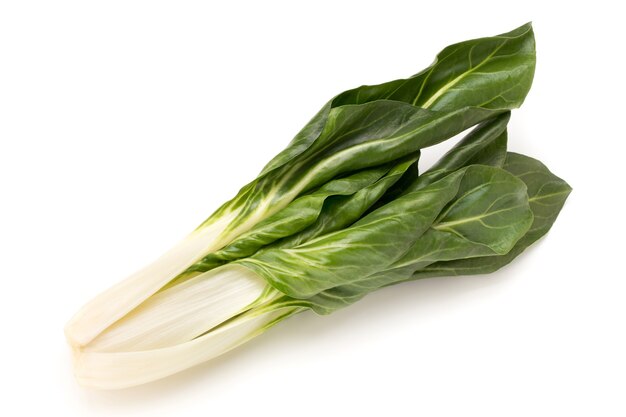 Spinach leaves close up isolated on white.