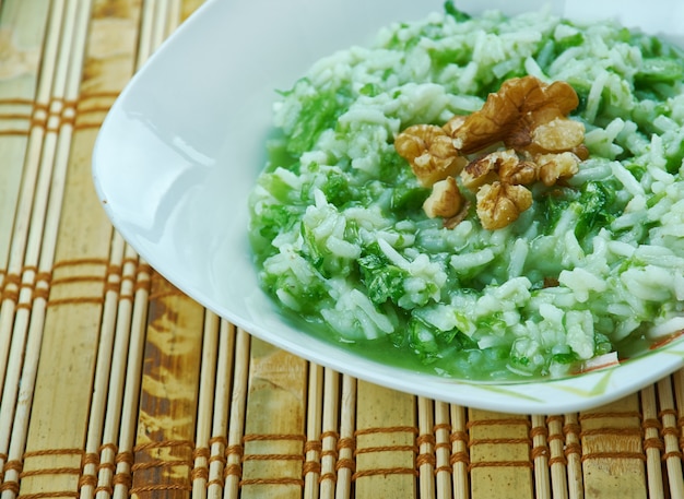 Spinach Palak Ki Khichdi - versatile Indian dish. made of rice, lentil and spinach with garlic flavoring.
