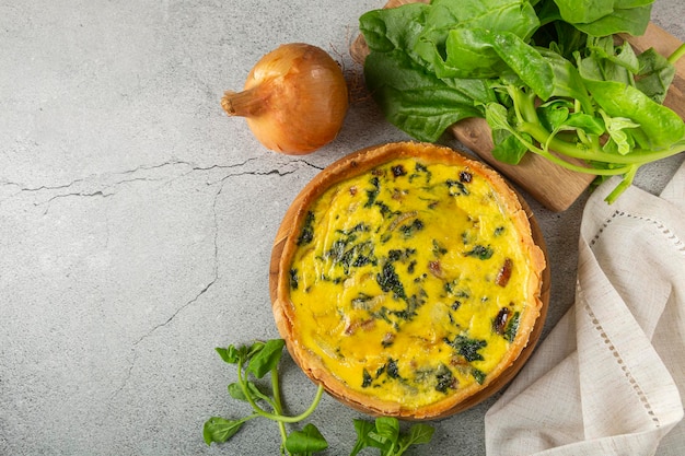 Spinach quiche with onion and bacon