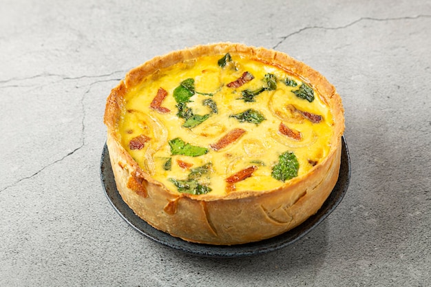 Spinach quiche with onion and bacon