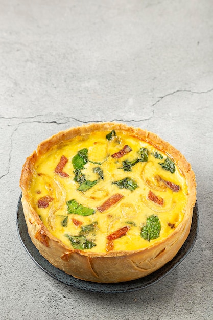 Spinach quiche with onion and bacon