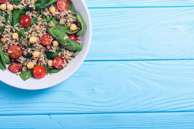 Spinach salad with quinoa tomatoes and chickpea Healthy vegan superfood