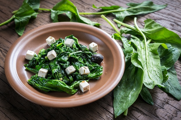 Spinach with cheese, olives