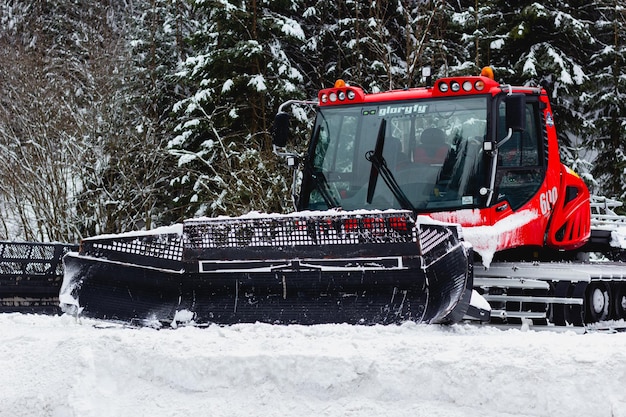 Photo spindleruv mlyn czech republic  january 27 2022 red snowplow